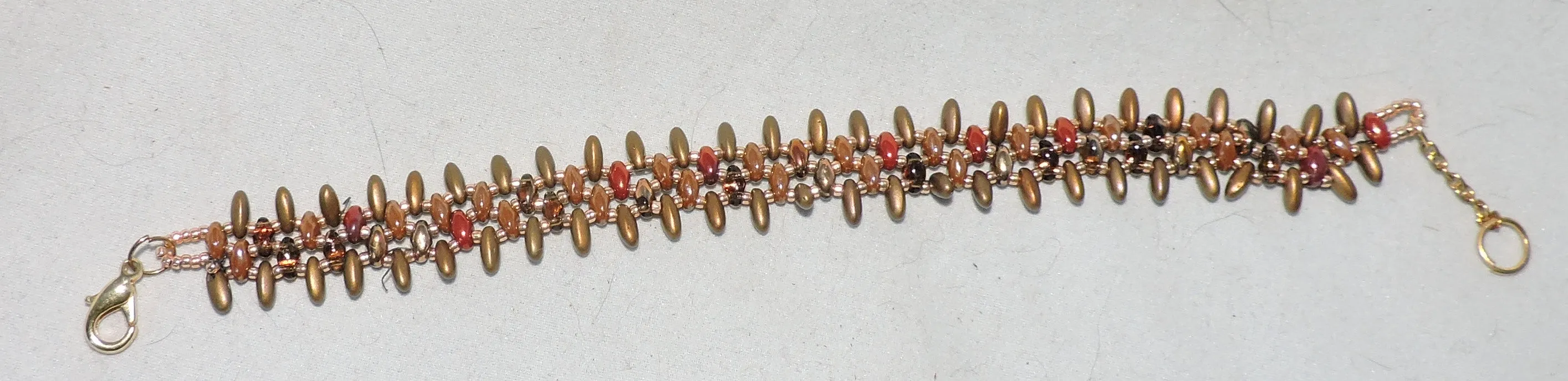 Bracelet with Varied Brown Tones and Gold Beads